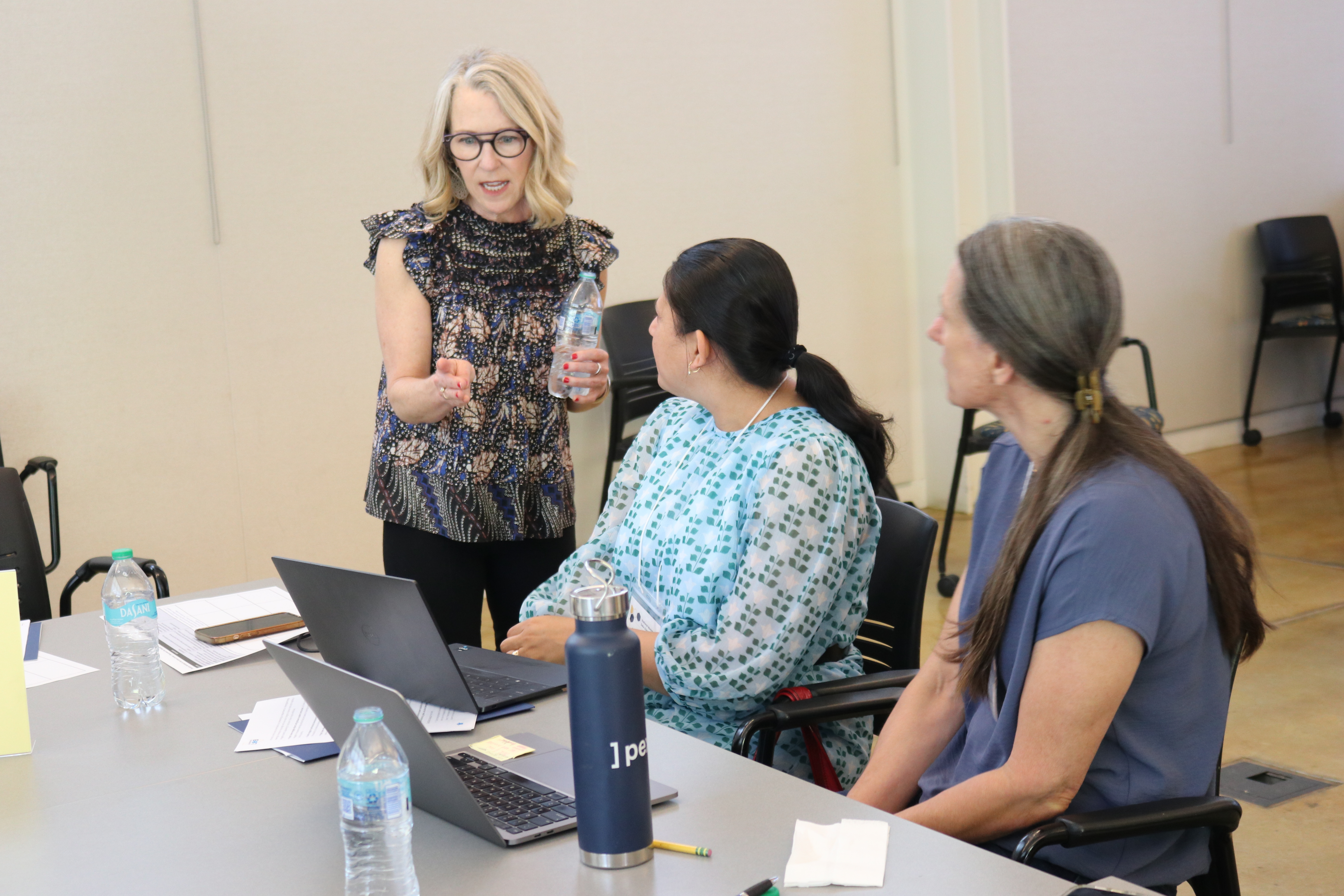 Educators collaborating at a table at the National Workshop for Data Science Education