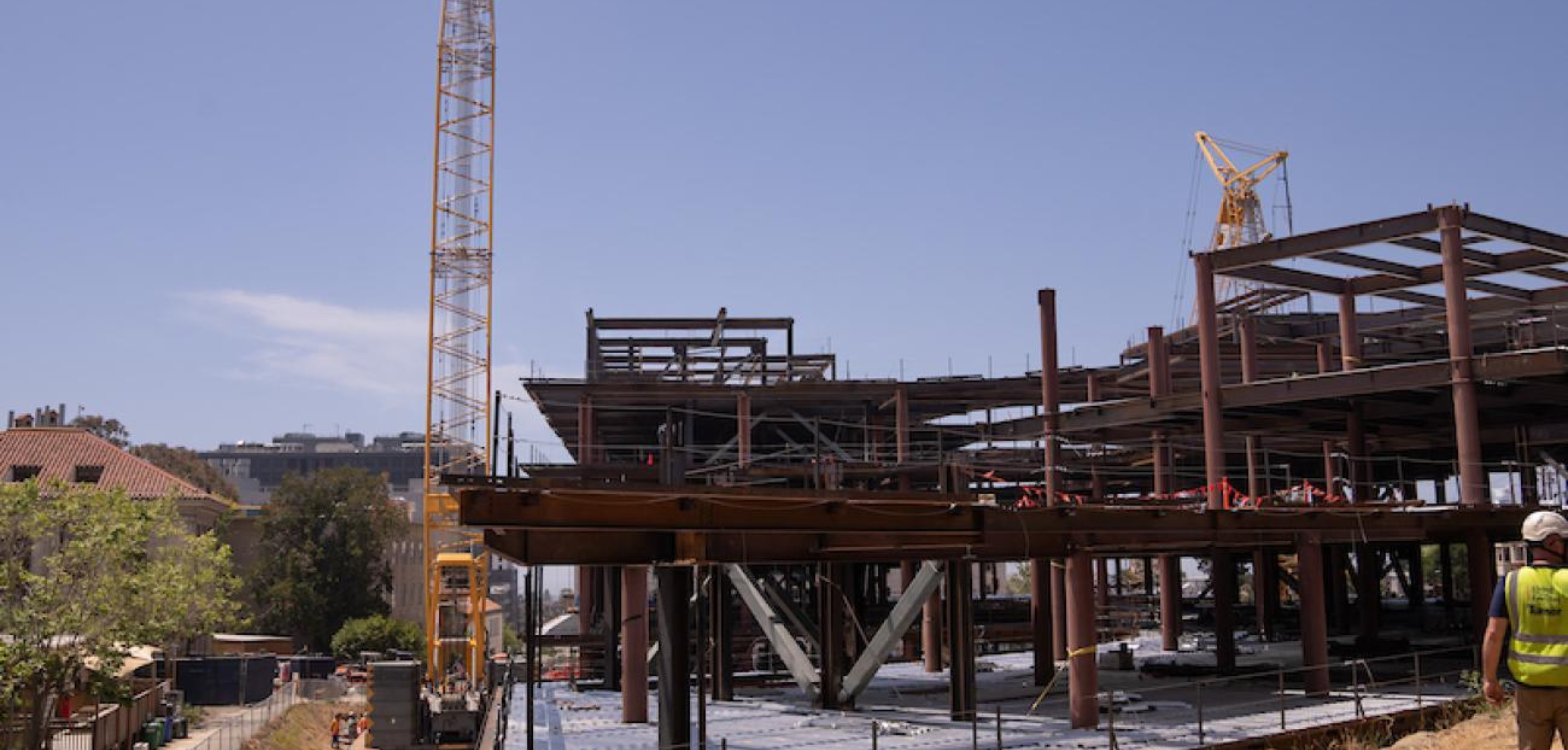 Construction workers placing the final steel beam onto the Gateway building