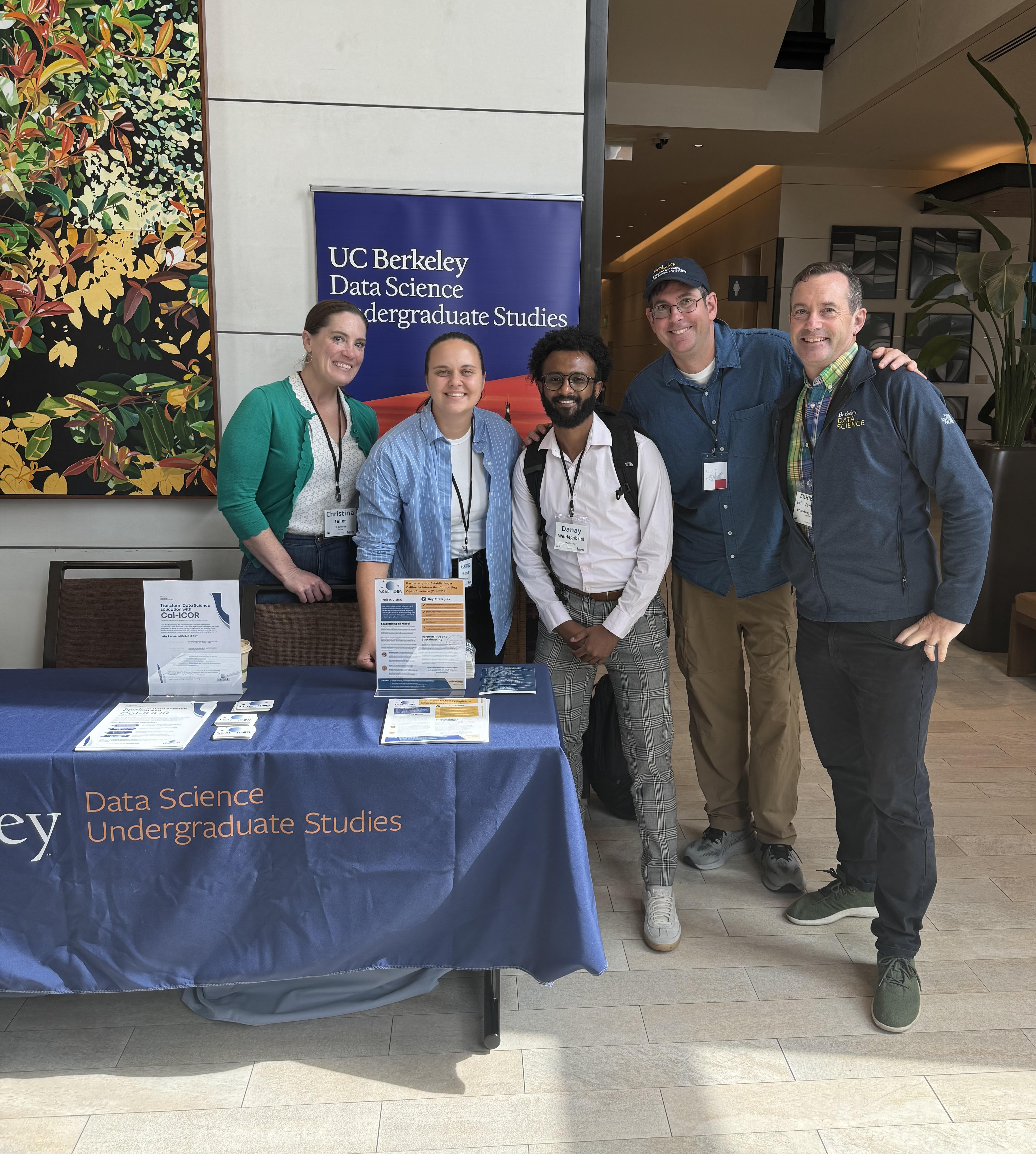 Data Science Undergraduate Studies staff and faculty table at the INSPIRE conference to spread the word about Cal-ICOR