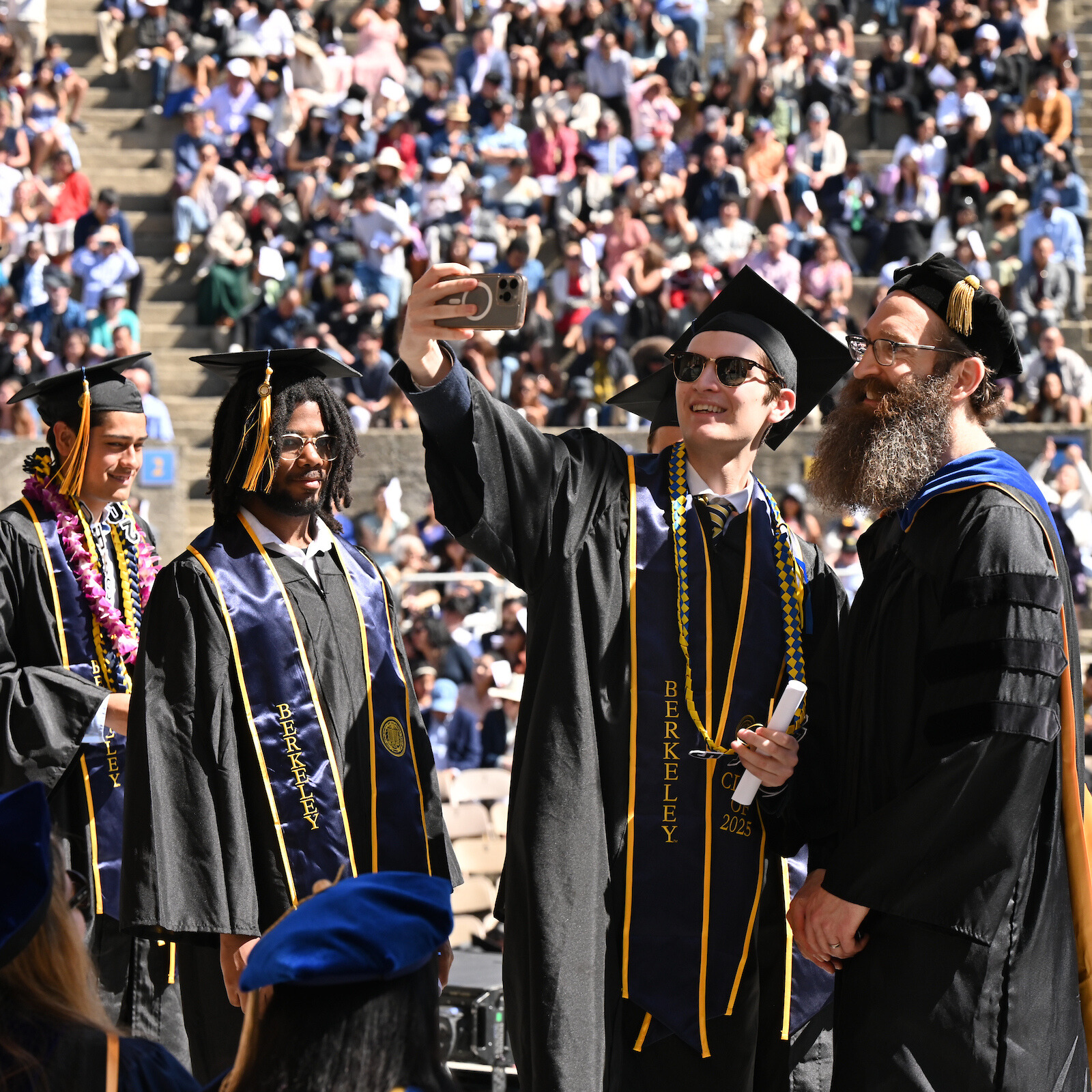 Andy Konwinski takes a selfie with graduate at the 2025 CDSS Commencement