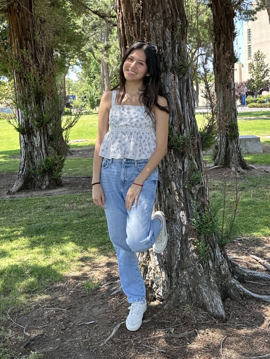 Nicole - DSPA leaning against a tree on UC Berkeley campus
