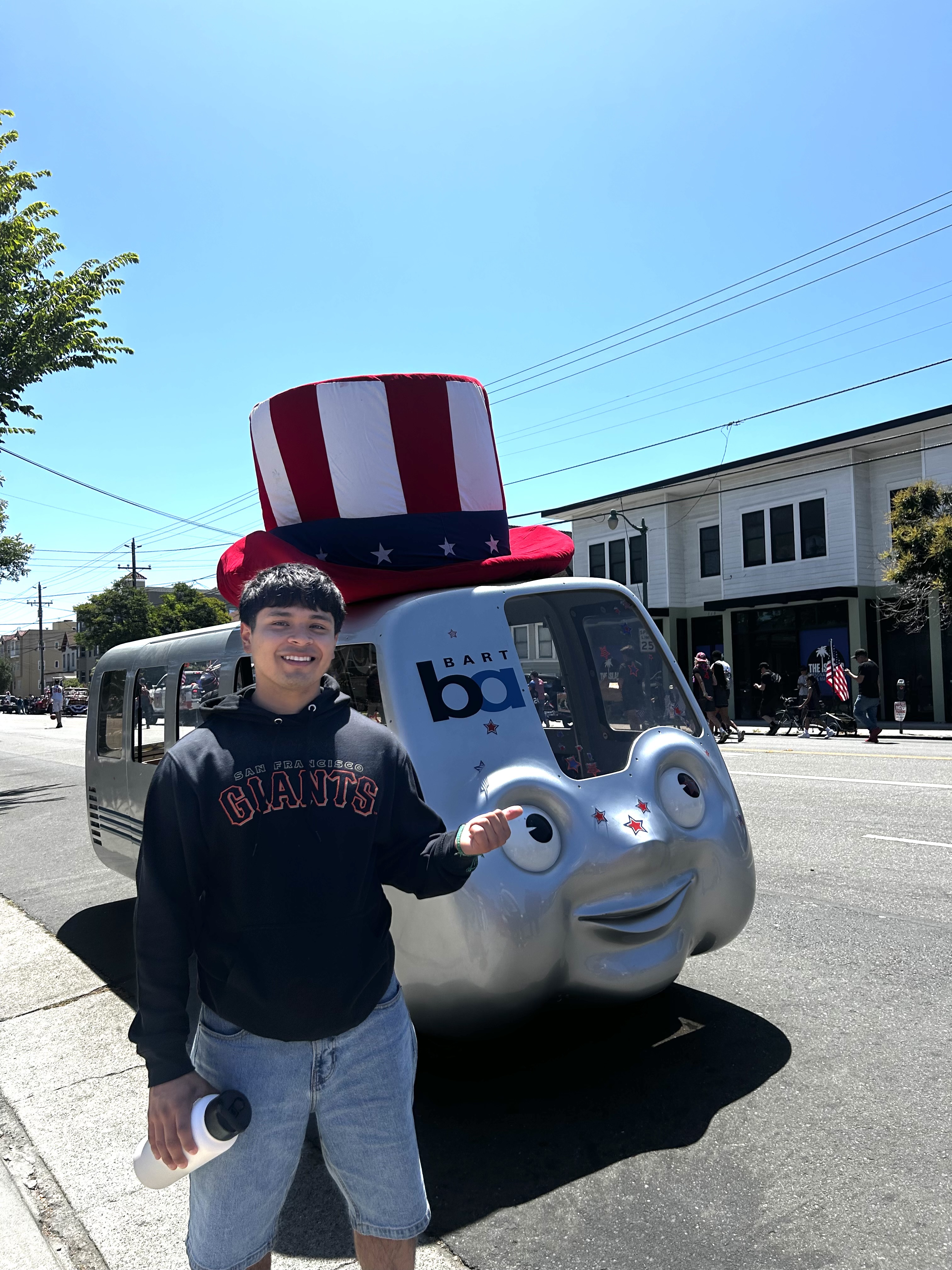 Angel DSPA posing in front of a Bart Van wearing an uncle sam hat.