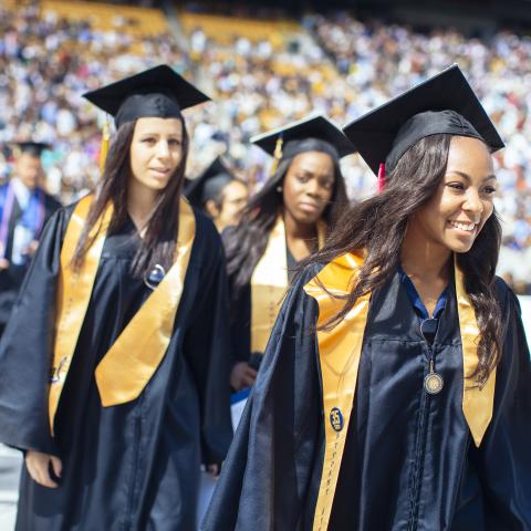 Graduates walk at UC Berkeley commencement in 2014. (Photo/ Elena Zhukova)