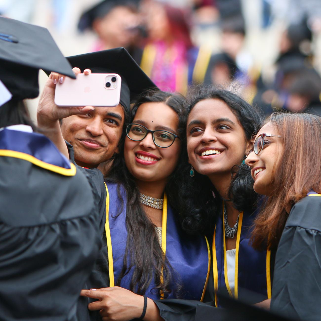 Students take a selfie at one of UC Berkeley's inaugural College of Computing, Data Science, and Society commencement ceremonies. (Photo/ Kayla Sim, UC Berkeley College of Computing, Data Science, and Society)