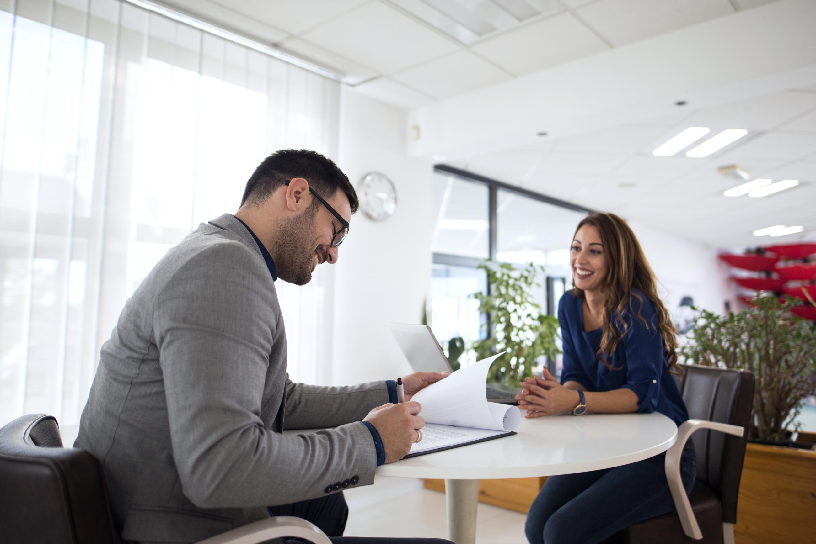 two people sitting down for a job interview