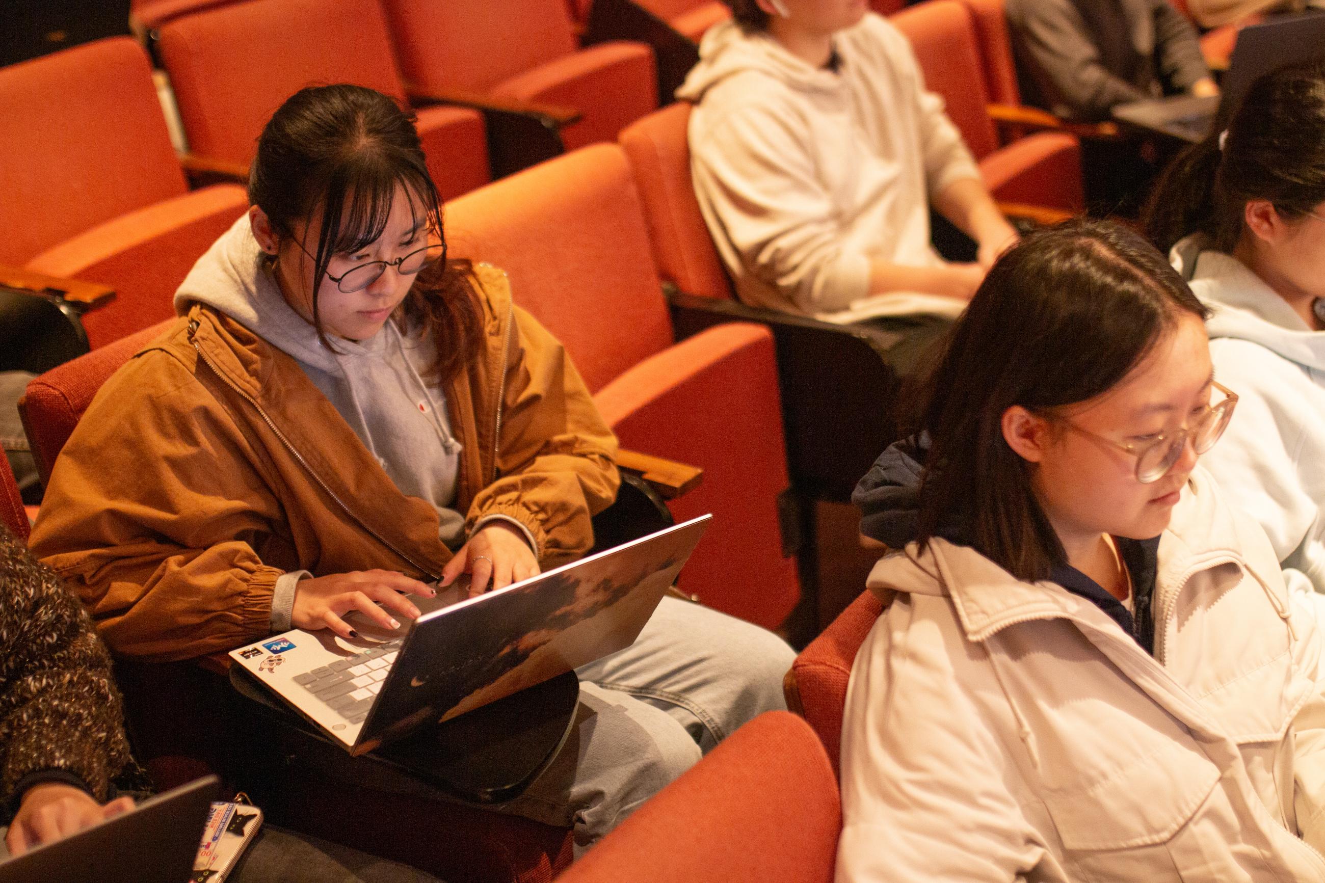 Students in CS10 lecture looking at their laptops