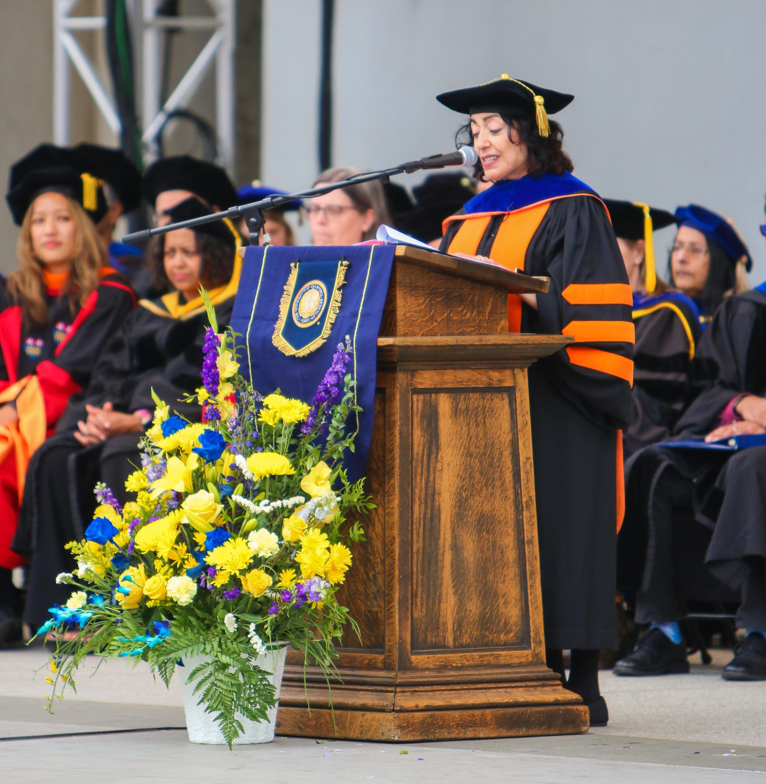 Jennifer Chayes speaking at the podium during the 2024 CDSS Commencement