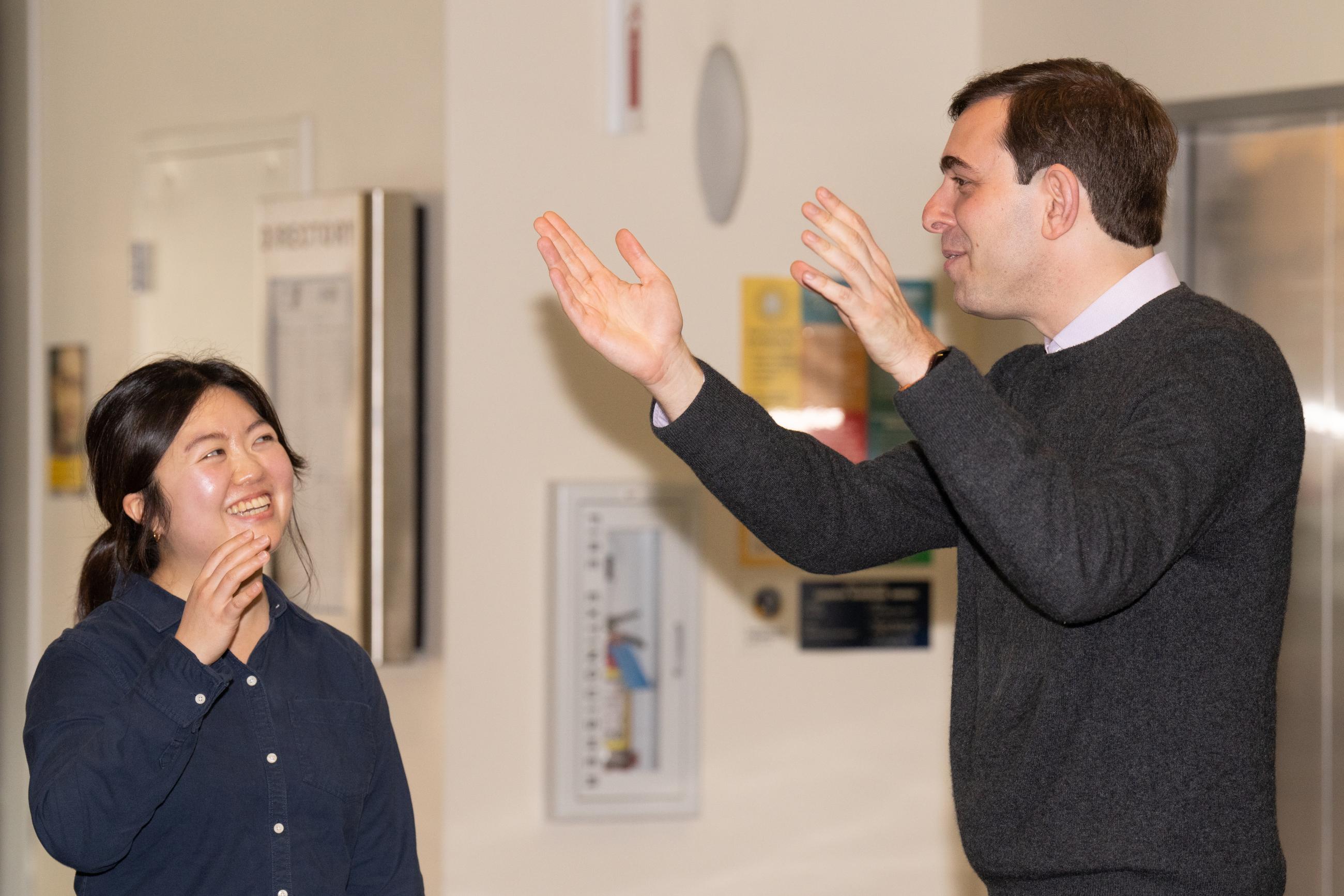 Zachary Bleemer (on right) speaks with a student after his lecture. (Photo/ Catharyn Hayne/ KLC fotos)