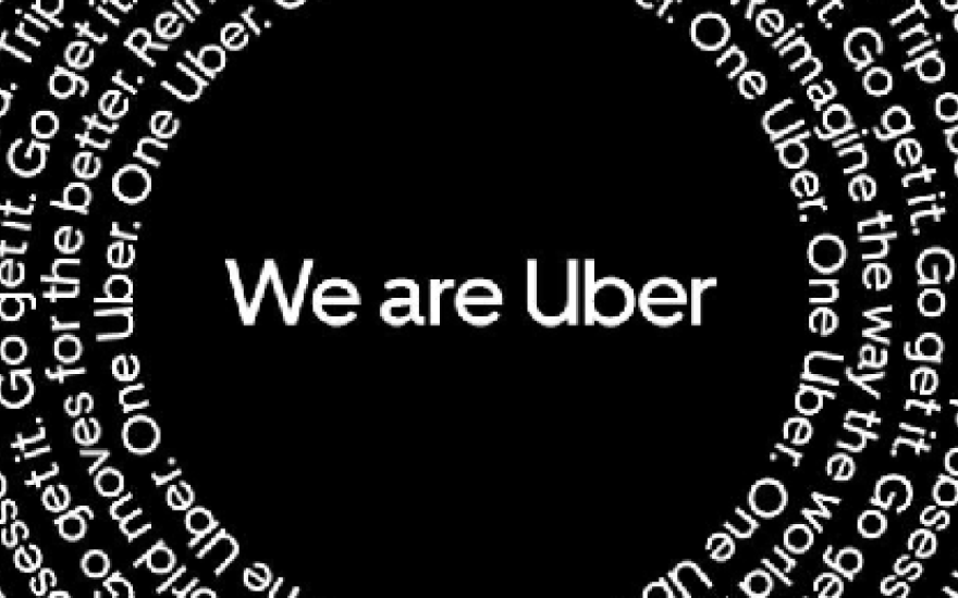 Graphic with black background and text "We are Uber" in center and in repeating circle around edge of frame